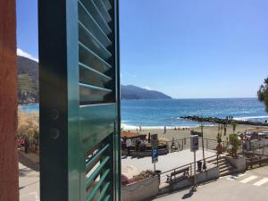 a view of a beach and the ocean from a building at Affittacamere Da Flo in Monterosso al Mare