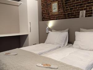 Een bed of bedden in een kamer bij Mijn appartement met sauna en lift