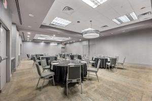a conference room with tables and chairs in it at DoubleTree Suites by Hilton Hotel Huntsville South in Huntsville