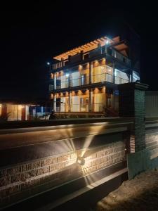 a building at night with its lights on at Little Hearts in Chennai
