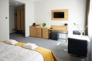 Łóżko lub łóżka w pokoju w obiekcie FACTORY RESORT wellness & spa