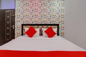 Postel nebo postele na pokoji v ubytování Hotel O Royal Dream