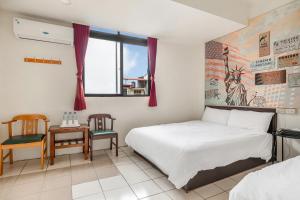 a bedroom with a bed and two chairs and a window at Forever Happiness Hostel in Puli