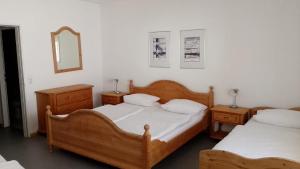 Postel nebo postele na pokoji v ubytování Hotel Zum Rebstock