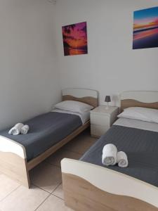 Postel nebo postele na pokoji v ubytování Appartamento 39