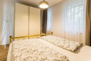 Ein Bett oder Betten in einem Zimmer der Unterkunft Velden - Villa right in the center with private parking