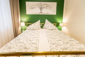 Ein Bett oder Betten in einem Zimmer der Unterkunft Velden - Villa right in the center with private parking