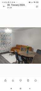 a room with a table and chairs and a couch at Villa Ruscello in Grabovac