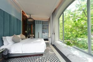 Postel nebo postele na pokoji v ubytování Dak Han Mansion Guangzhou