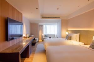 Ένα ή περισσότερα κρεβάτια σε δωμάτιο στο Kilin Hotel, JiaoXi