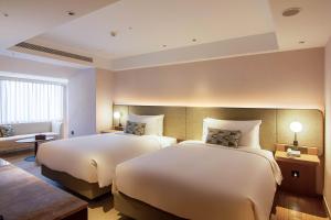 Ένα ή περισσότερα κρεβάτια σε δωμάτιο στο Kilin Hotel, JiaoXi