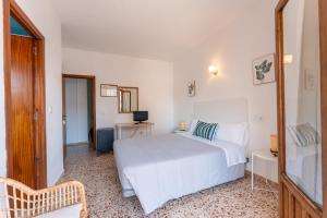 Кровать или кровати в номере Hotel Buigues