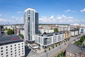 an aerial view of a city with tall buildings at "Station" - Modern 1BR with Sauna next to Railway Station, Hosted by 2ndhomes in Tampere