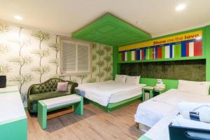 Postel nebo postele na pokoji v ubytování Show Hotel Haeundae