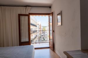 Кровать или кровати в номере Hotel Buigues