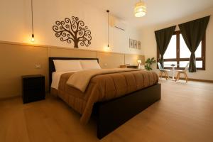 A bed or beds in a room at Camurria Sicilian B&B
