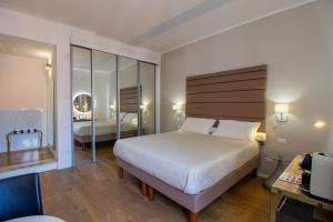 Posteľ alebo postele v izbe v ubytovaní Album Boutique Rooms