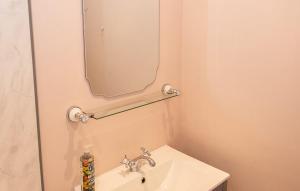a bathroom with a sink and a mirror at Old Vicarage Mortehoe Near Woolacombe 2 x sleeps 4 and 1 x sleeps 10 cottages in Mortehoe