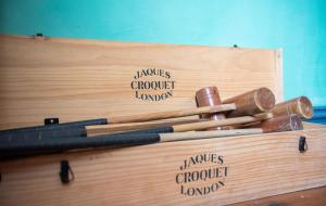 a wooden box with several different types of wooden knives at Old Vicarage Mortehoe Near Woolacombe 2 x sleeps 4 and 1 x sleeps 10 cottages in Mortehoe