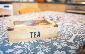 a wooden box sitting on top of a table at Old Vicarage Mortehoe Near Woolacombe 2 x sleeps 4 and 1 x sleeps 10 cottages in Mortehoe