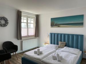Postel nebo postele na pokoji v ubytování Hotel meerblau