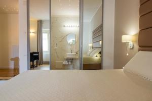 Posteľ alebo postele v izbe v ubytovaní Album Boutique Rooms