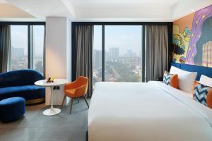 ibis Styles Jakarta Tanah Abang客房内的一张或多张床位