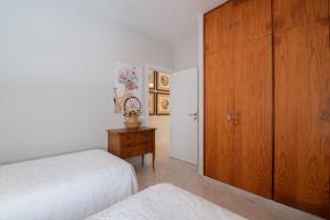 En eller flere senge i et værelse på El Amanecer - villa privada con piscina agua salada, barbacoa y chimenea