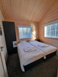 Postel nebo postele na pokoji v ubytování Arctic Home Experience