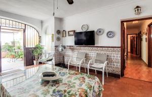 a living room with a tv and a table and chairs at Mirador De Arcos in Arcos de la Frontera