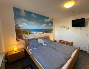 TV a/nebo společenská místnost v ubytování Seeadler, Ferienwohnung 4