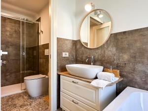 a bathroom with a sink and a mirror at Sogni di Paglia - Eco Country House in Monforte dʼAlba