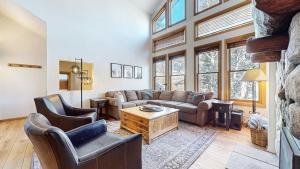 a living room with a couch and two chairs at Snowcreek V #874 condo in Mammoth Lakes