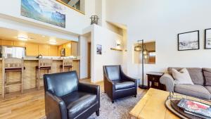 a living room with a couch and two chairs at Snowcreek V #874 condo in Mammoth Lakes