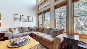 a living room with a couch and some windows at Snowcreek V #874 condo in Mammoth Lakes