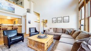 a living room with a couch and two chairs at Snowcreek V #874 condo in Mammoth Lakes +38 photos