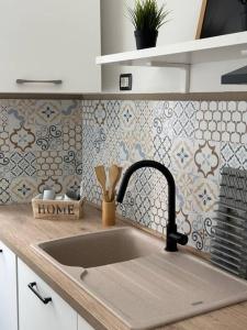 Kuchyň nebo kuchyňský kout v ubytování Fanciulla D'Anzio Home