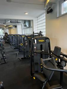 a gym with several rows of treadmills and machines at Bungalows SPORT CENTAR in Međugorje