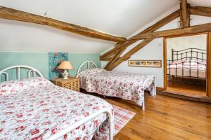 Ένα ή περισσότερα κρεβάτια σε δωμάτιο στο La Petite Maison d'Allemans - Piscine, Grand Jardin