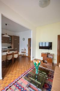 a living room with a couch and a table at Casa Giuly in Lezzeno