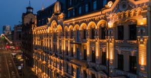 a building with lights on the side of it at CITYHOTEL Residence in Kyiv
