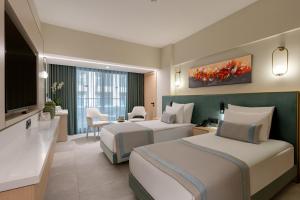 Postel nebo postele na pokoji v ubytování Bergiz Hotels & Resorts Kemer + 57 fotografií