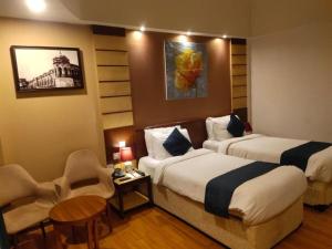 Postel nebo postele na pokoji v ubytování Hotel Le Mount Suit Inn
