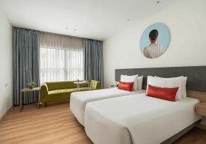 Postel nebo postele na pokoji v ubytování Hotel Le Mount Suit Inn
