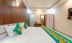 Postel nebo postele na pokoji v ubytování Hotel Le Mount Suit Inn