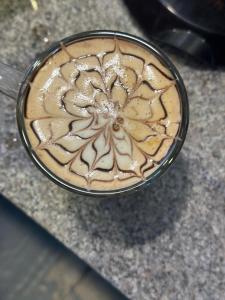 a cup of coffee sitting on top of a counter at Hotel Shiva Yog Sthal in Rishīkesh