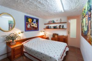 Postel nebo postele na pokoji v ubytování MASIA CAN SUNYER AGROTURISMO + 37 fotografií