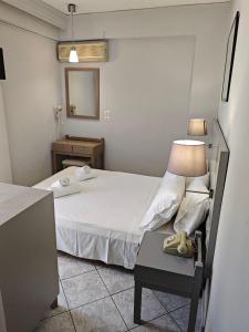 Postel nebo postele na pokoji v ubytování Karis Hotel
