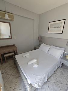 Postel nebo postele na pokoji v ubytování Karis Hotel