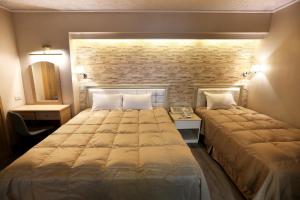 Postel nebo postele na pokoji v ubytování Doitsu Hotel + 37 fotografií